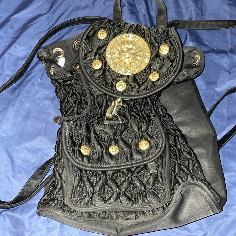 Black backpack with a sun